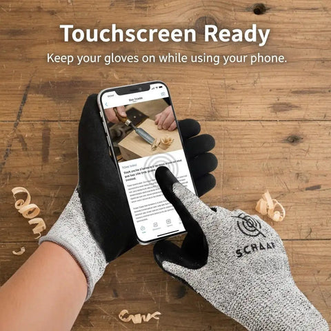 Wood Carving Gloves No Nonsense Hand Protection Heavy Duty Level 5 Cut Resistant gloves in use on smartphone screen on workshop table