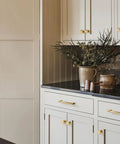 10 Pack Modern Round Cabinet Knobs In Champagne Bronze on kitchen cabinets with vase on countertop, zinc alloy finish
