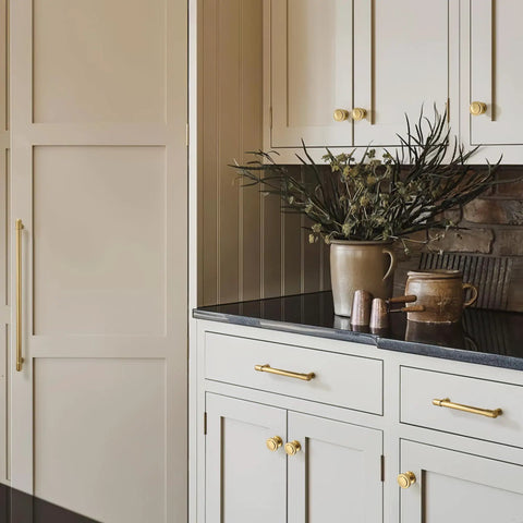 10 Pack Modern Round Cabinet Knobs In Champagne Bronze on kitchen cabinets with vase on countertop, zinc alloy finish