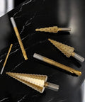 Six Piece High Speed Reaming Pagoda Sawtooth Drill Bit Set With Titanium Plating In Box For Metal And Wood, displayed on marble surface