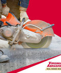 Worker using 14 Inch Supreme Pro High Speed Diamond Blade For Concrete And Asphalt Wet Or Dry Cutting Laser Welded Tough Grit Evolutionary Design 14 Inch By.125 Inch By 1 Inch Segments 20mm To 10mm on asphalt