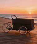 Kickstart Your Curbside Hustle With This Heavy Duty Outdoor Coffee Cart Featuring A Wide Canopy Sun Shade And Smooth Rolling Wheels For Mobile Vending Or Pop Up Market Sales, on a wooden pier at sunset.