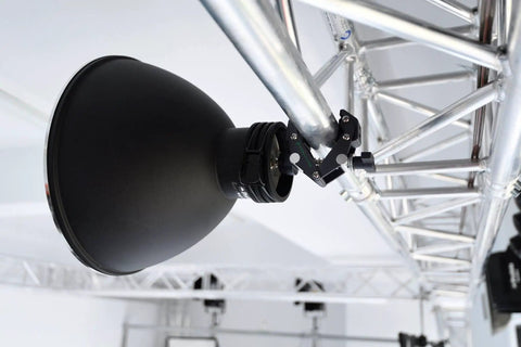 Savior Clamp With Articulated Jaws, 66 Lb Max Load, Two 1/4-20 And Two 3/8-16 Threads in use on truss with black lighting gear