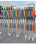 Heavy Duty Adjustable Stainless Steel Retractable Safety Gate Featuring Hella Smooth Moving Universal Casters And Rock Solid Brakes For Tight Garage And Store Layouts with colorful bands.