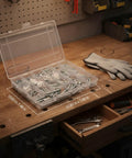All In One Screw Nut And Washer Assortment Kit M3 To M6 Carbon Steel Hardware Set With Storage Box And Gloves on a workbench