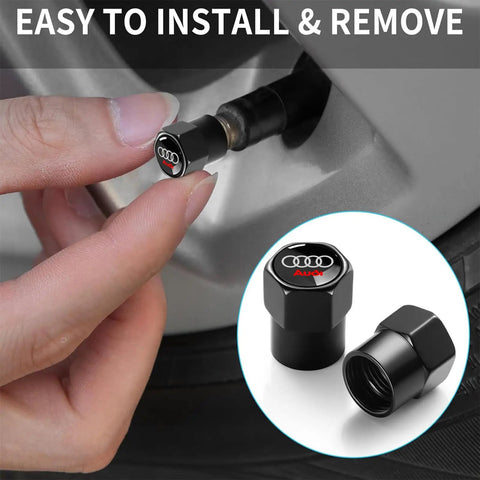 Audi Tire Valve Stem Caps 4 Pack Aluminum Alloy Metal Air Caps For Car Wheels Black Finish Durable Protect Valves From Leaks And Wear Easy Install Now, showing close-up of cap installation on car wheel.