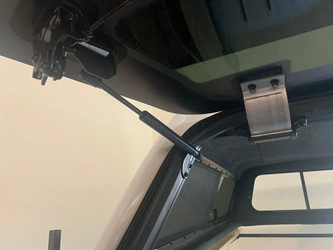 No Fuss 12 Inch Gas Strut Lift Kit For Camper Shells showing installed strut on a truck cap, designed for smooth operation and durability.