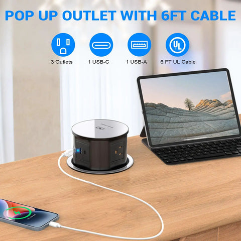 Pop Up Countertop Power Outlet With 20W USB C Fast Charge Hidden Recessed Socket Four AC Plugs And One USB A Port Top Qi Wireless Charger For Kitchen Four Point Seven Inch Built In Pop Up Outlet Black shown on countertop powering devices