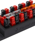 Reliable Nine Position Fused Distribution Panel With Powerpole Terminals and Interchangeable Automotive Blade Fuses mounted on a black base.