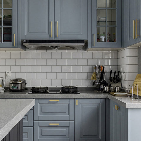 Modern kitchen with blue cabinets featuring 30 Pack Gold Cabinet Handles 5 Inch Brushed Brass T Bar Drawer Pulls, 128mm Center.