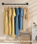 Built Like A Tank Wall Mounted Clothes Rack 3 Pack Black Industrial Pipe Garment Rail with dresses in laundry room.