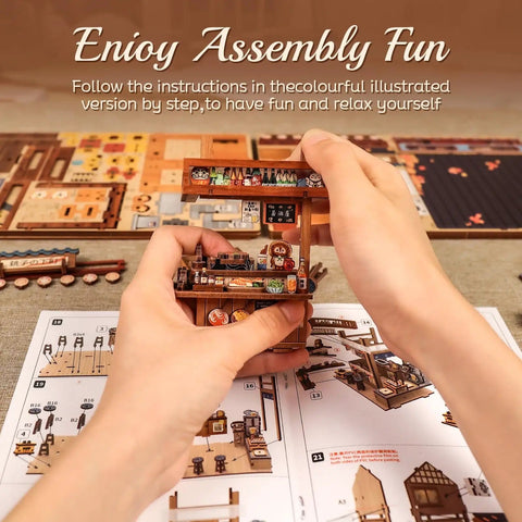 Hands assembling Dope DIY Japanese Izakaya Book Nook Kit For Adults Teens And Beginners, showing parts and instructions.