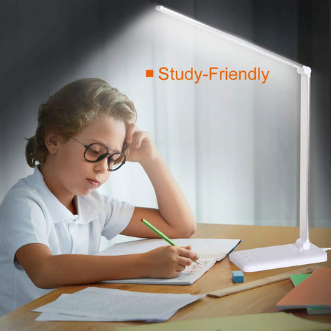 Eye Caring LED Desk Lamp With USB Charging Port, Touch Dimmable Office Light on desk with child studying.