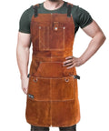 Rugged Leather Welding Apron With Eleven Tool Pockets For Woodworking And Metalworking, model wearing in brown leather.