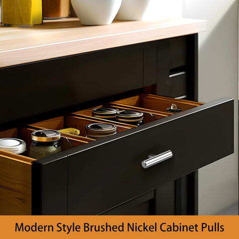 Open black kitchen drawer with modern brushed nickel cabinet pull, showcasing organized spice jars on wooden rails.