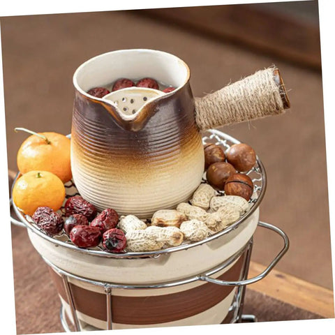Turkish Coffee Pot Ceramic Milk Pan With Pour Spout Heat-Resistant Coarse Pottery for Tea and Coffee, filled with fruits and nuts.