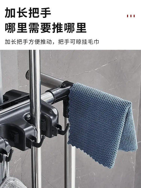 Side view of a Floor Standing Mop And Broom Organizer Rack With Foldable Hooks, showing stainless steel frame and cleaning tools.