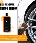 GM TPMS Relearn Tool For Tire Sensor Activation EL-50448 in hand near a tire, a compact tool for cars and trucks.