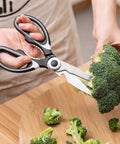 Heavy Duty Kitchen Scissors With Stainless Steel Blades, Sharp Shears For Meat, Fish, Poultry, And Veggies, Ergonomic TPR Grip, Multipurpose Cooking Scissors For Cutting, Slicing, And Deboning cutting broccoli on a wooden board