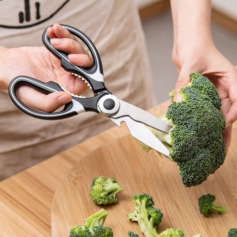 Heavy Duty Kitchen Scissors With Stainless Steel Blades, Sharp Shears For Meat, Fish, Poultry, And Veggies, Ergonomic TPR Grip, Multipurpose Cooking Scissors For Cutting, Slicing, And Deboning cutting broccoli on a wooden board
