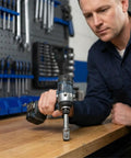 Person using cordless drill with Heavy Duty Impact Socket Adapter Set For Impact Drivers And Drills Three Piece Conversion Kit