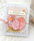 DIY card featuring Seven Piece Easter Egg Die Cuts Set With Flower And Butterfly Frame Dies, floral decorations, and spring message