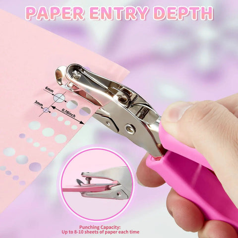 Two Pack Handheld Hole Punches With One Quarter Inch And One Eighth Inch Holes Soft Pink Grip shown punching paper