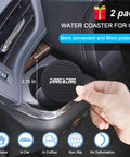 Hand placing black water coaster into car cup holder, part of Two Pack Silicone License Plate Frame For US And CA Standard Cars Front And Back Cover All Weather Rustproof And Rattleproof With Water Coasters Black set.