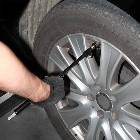 Front view of WYNNsky heavy-duty dual-head air pressure gauge with extended tube attached to a car tire valve