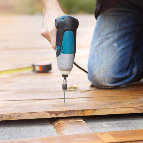 Person using a power drill with Self Tapping And Self Drilling Kit In 410 Stainless Steel With Washer Head on wooden plank