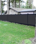 Heavy Duty Privacy Screen Fence Mesh Cover 6 Ft By 50 Ft Black Outdoor Shade Net installed in garden blocking view