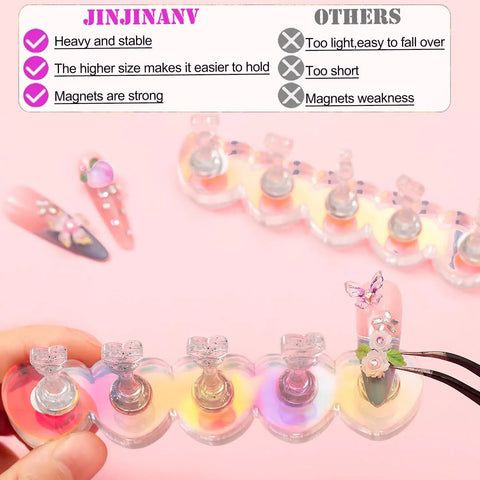 Pro Grade Magnetic Nail Stand For Press Ons With Thick Base And Taller Pegs Anti Tip Acrylic Nail Holder With Reusable Adhesive Tape Stays Steady While You Paint 1000 Practice Uses And Zero Magnetism Loss shown with heart-shaped pegs.