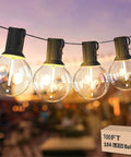 Four illuminated G40 bulbs on 100ft string, showcasing Two Pack 100Ft LED Outdoor String Lights With 104 Vintage G40 Bulbs, dimmable and UL listed.