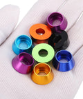 M8 Cone Cup Washers Anodized Aluminum Titanium Gray Flange Gaskets Heavy Duty Fasteners For Rc Drones Cars And Modded Builds Top Shelf 20 Pack Custom Hardware Set in various colors on a gloved hand.