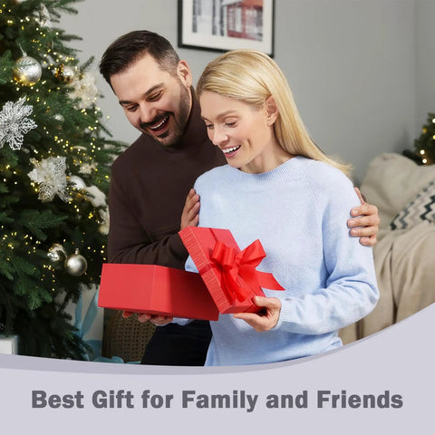 Couple exchanging a red gift box near Christmas tree with text 'Best Gift for Family and Friends'