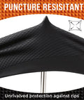 Close-up of black textured nitrile glove with diamond pattern grip