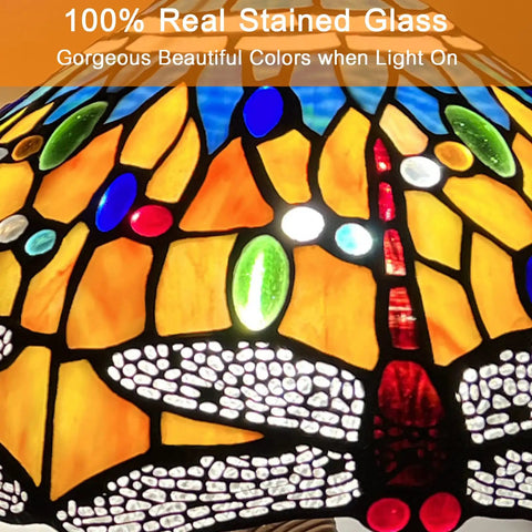 Close-up of the stained glass shade from Grapefruit Orange Dragonfly Tiffany Style Table Lamp with colorful dragonfly design