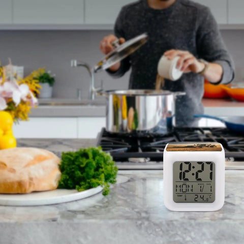 Farm Tractor Alarm Clock With LED Display, Seven Color Night Light in a kitchen setting near a bread loaf and greens