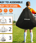Child carrying Backyard Pop Up Soccer Goals Set of 2 for Kids, 4x3ft Training Nets with bag, on a grass field.