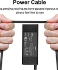 Hands holding power cable of 12V AC Power Adapter For Korg KROME EX 61 Key Music Workstation Keyboard Charger, Worldwide 100V To 240V Input