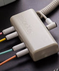 Close-up of MickXer 5 Way Passive Mixer with Candycord Color Cables Six Pack and Noise Filtering Kit connected to cables