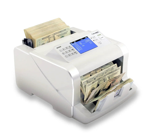 Fast Mixed Currency Money Counter That Handles US Dollars Euros Canadian Dollars British Pounds And Mexican Pesos With Quick Counting And 5 Point Counterfeit Detection UV MG IR DD MT DBL HLF CHN S6500 in use counting bills with display screen.