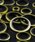 Close-up of Heavy Duty Dowty Bonded Seal Washer Set For Metric M6 To M24 180-Piece Kit on black background