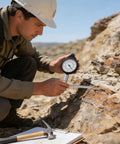 Heavy Duty Rock Solid Map Distance Measurer Built Like A Tank For Spot On Tracking And No Sweat Handling On Rough Outdoor Job Sites By Seasoned Surveyors And Engineers in use by a field surveyor.