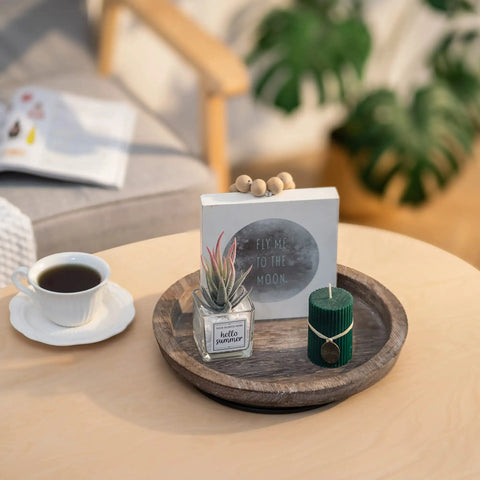 Solid Wood Lazy Susan Set Big Round Serving Tray With Hella Smooth Ball Bearing Turntable Base For Kitchen Counter And Dinner Party Centerpiece Slick Spinning Organizer Easy Setup Stand with green candle and decor.