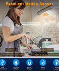 Woman cooking under cabinet with Under Cabinet Light Kit With 80 LED Wireless Puck Lights Dimmable 3000mAh Battery Motion And Night Sensor.