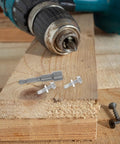 Drill and fasteners with 410 Stainless Steel Socket Head Cap Screw Set, 100 Piece Assortment Kit on wooden board