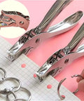 Metal Handheld Hole Puncher With 3Mm And 6Mm Circular Holes, punches A4 paper, shown with binder rings, steel build tool for office