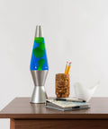 Classic 14.5 Inch Silver Base Lava Lamp With Yellow Wax In Blue Liquid For Instant Mood Lighting on a wooden table in living room.