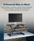 Vari Pro Plus 36 Electric Standing Desk Converter in stylish walnut finish, adjustable height, dual monitor setup.